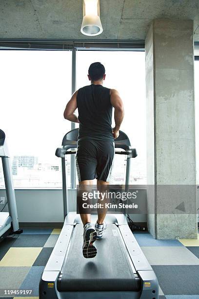 modern couple excercise - running on treadmill stock pictures, royalty-free photos & images