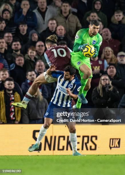 Brighton & Hove Albion's Matthew Ryan battles with Aston Villa's Jack Grealish during the Premier League match between Brighton & Hove Albion and...