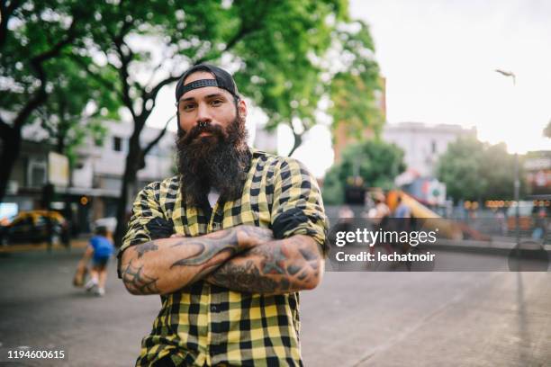 young man using smartphone in the street - hipster guy stock pictures, royalty-free photos & images