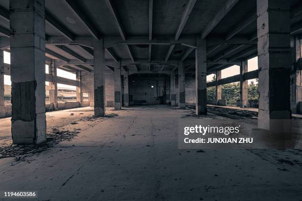 interior of abandoned factory - abandoned factory stock-fotos und bilder