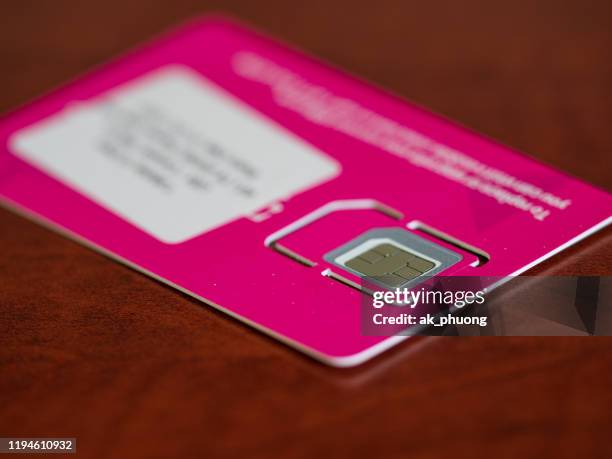 mobile phone sim card - sim karte stock-fotos und bilder