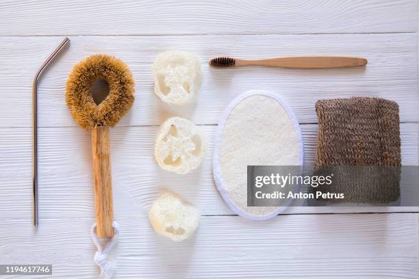 different types of zero waste sponges, toothbrush and water pipe. flat lay style.zero waste concept - loofah stock pictures, royalty-free photos & images