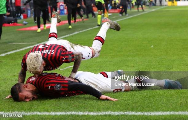 Theo Hernandez of AC Milan celebrates his goal with his team-mate Samuel Castillejo during the Serie A match between AC Milan and Udinese Calcio at...