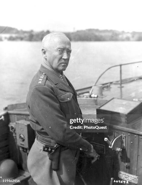 American military commander General George S. Patton , Commander of the US 3rd Army, pilots a motor launch on Lake Attersee, near Salzburg, Austria,...