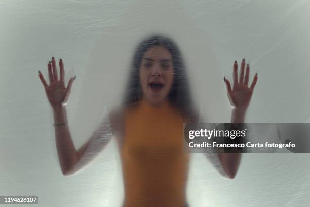 woman trapped in plastic sheet - stifle stock pictures, royalty-free photos & images