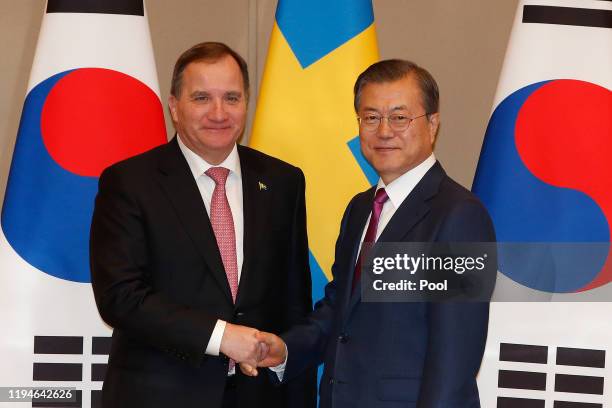 South Korea's President Moon Jae-in shakes hands with Sweden's Prime Minister Stefan Lofven during their meeting at the presidential blue house on...