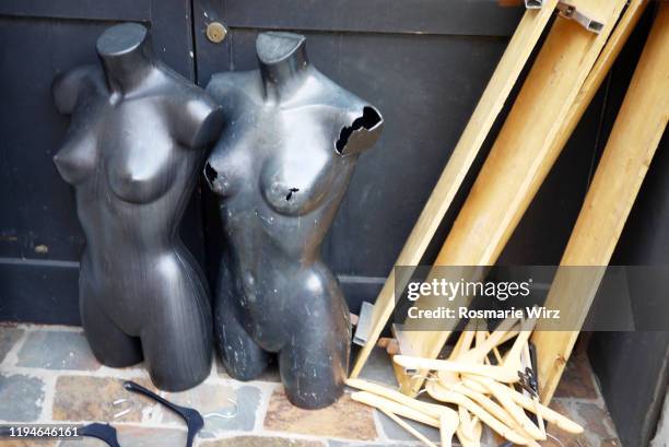 two damaged plastic dummies for waste disposal - broken shop window stock pictures, royalty-free photos & images