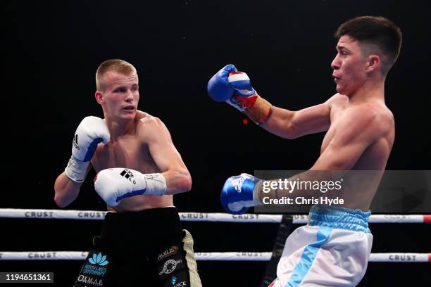Liam Wilson of Australia knocks down Mauro Perouene of Argentina in the IBF Super Featherweight World Youth Title fight before the middleweight bout...