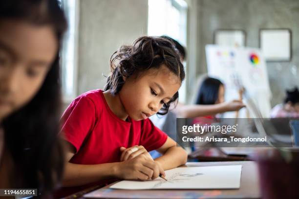 young group of students in an arts in school - very young thai girls stock pictures, royalty-free photos & images