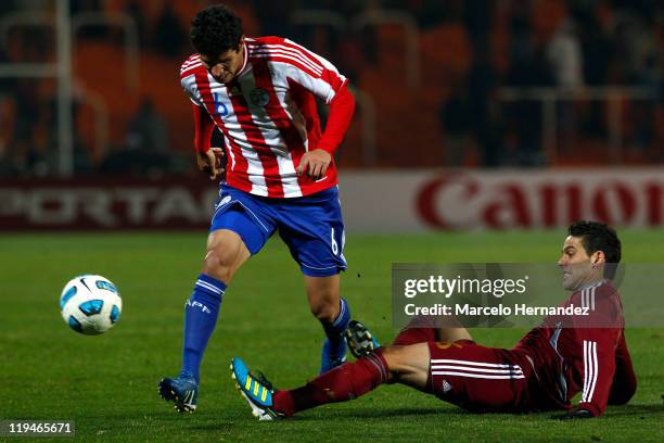 Marcos Cáceres, from Paraguay, fights for the ball with Giancarlo Maldonado, from Venezuela, during a semi final match at Malvinas Argentinas Stadium...