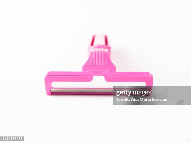 close up of disposable pink razor on a white background - pubic hair stock pictures, royalty-free photos & images