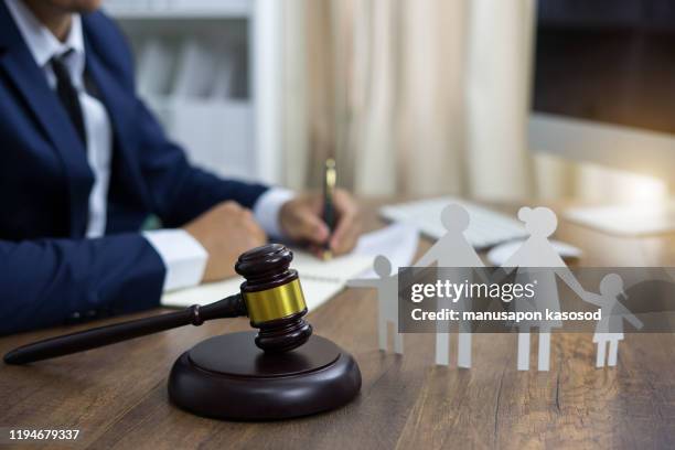 family figure and gavel on table. family law concept - divorce lawyer stock pictures, royalty-free photos & images