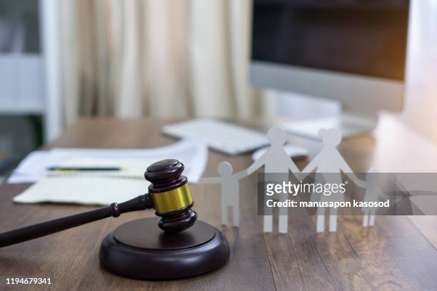 family figure and gavel on table. family law concept - family law stock pictures, royalty-free photos & images