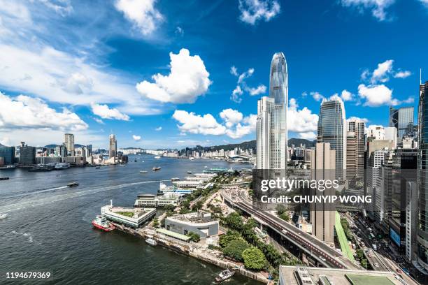 view of the hong kong skyline - hong kong skyline drone stock pictures, royalty-free photos & images