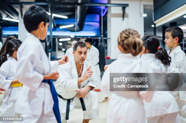 children teaching karate in nursery school. - 空手 ストックフォトと画像