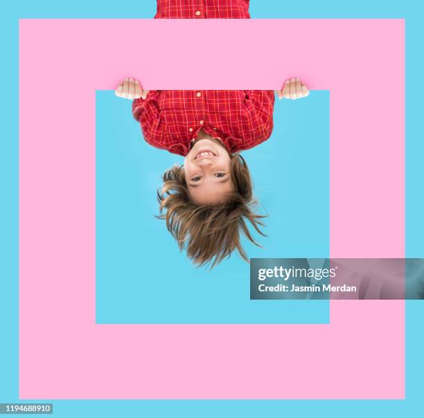 smiling child on blue background with colorful frame design shapes - cheerful abstract stock pictures, royalty-free photos & images