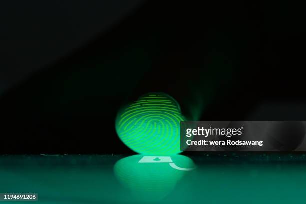 close up photography of finger while scanning touch screen to open digital device - signature collection stock-fotos und bilder