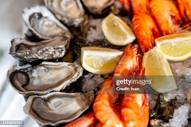 close up of fresh seafood on ice plate - clam seafood stock pictures, royalty-free photos & images