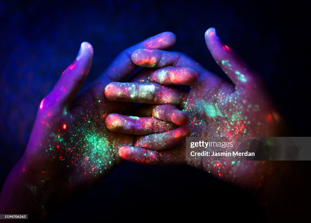 Abstract. Art. Hands. Ultraviolet. Particles. Universe.