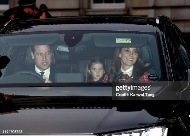 Prince William, Duke of Cambridge, Princess Charlotte and Catherine, Duchess of Cambridge attend Christmas Lunch at Buckingham Palace on December 18,...