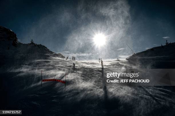 People ski in the strong wind during the 2020 Lausanne Winter Youth Olympic Games at the Leysin ski resort after the slope style contest was...