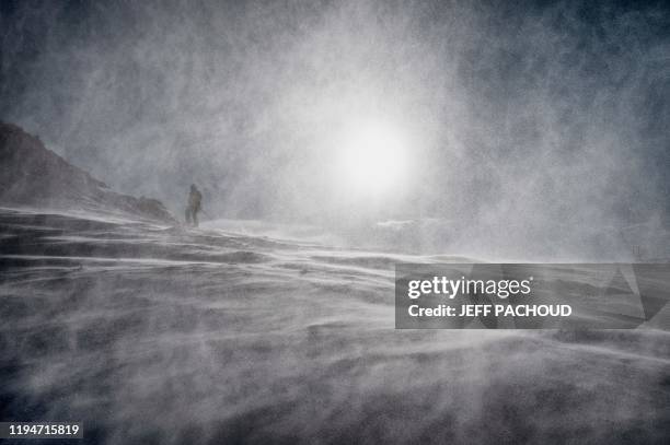 People ski in the strong wind during the 2020 Lausanne Winter Youth Olympic Games at the Leysin ski resort after the slope style contest was...