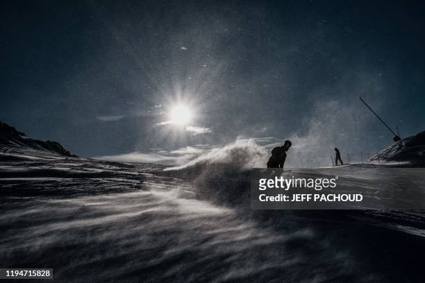 People ski in the strong wind during the 2020 Lausanne Winter Youth Olympic Games at the Leysin ski resort after the slope style contest was...