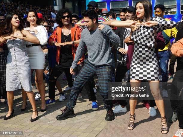 Nora Fatehi , Varun Dhawan and Shraddha Kapoor attend the 'Street Dancer' film trailer launch on December 18, 2019 in Mumbai, India.
