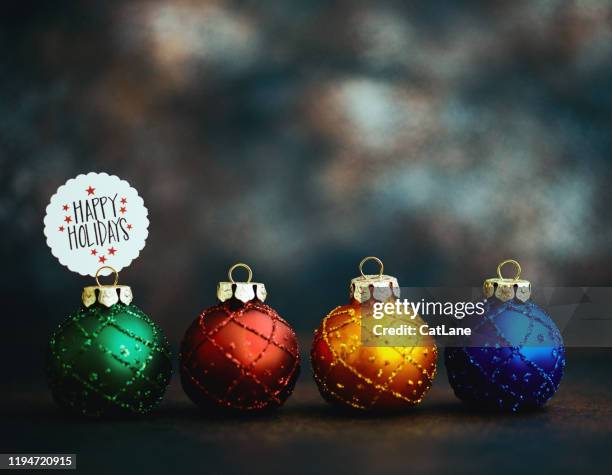 christmas ornament background with holiday message: happy holidays - happy holidays stock pictures, royalty-free photos & images