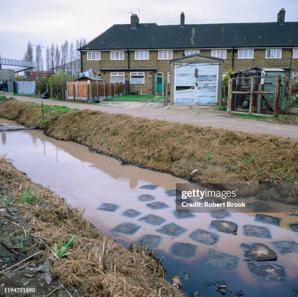 water polluted with chemicals. shot on medium format film. - britain in the 90s stockfoto's en -beelden