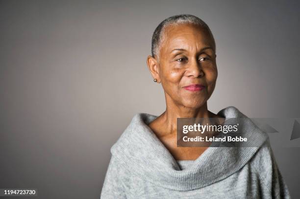 portrait of senior african american woman - senior woman studio stock pictures, royalty-free photos & images