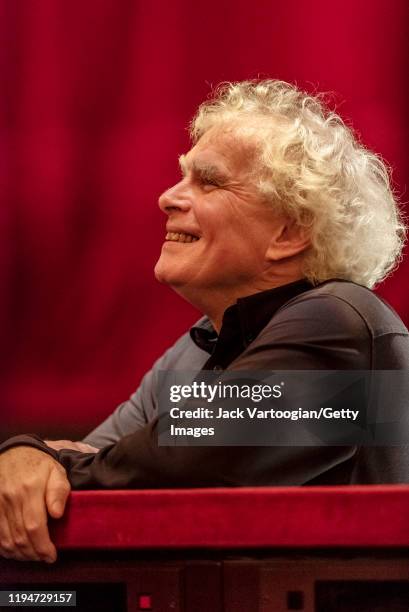 Close-up of British conductor Sir Simon Rattle during a break in the final dress rehearsal prior to the season revival of the Metropolitan...