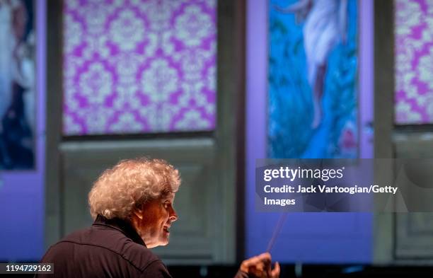 View, from behind, of British conductor Sir Simon Rattle during the final dress rehearsal prior to the season revival of the Metropolitan...