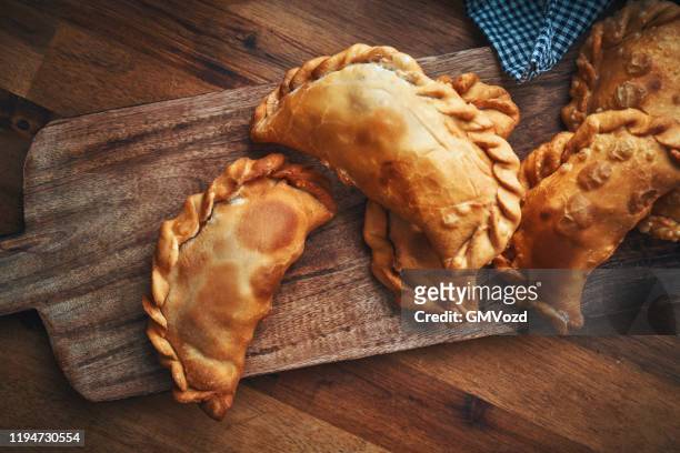 argentinean empanadas with meat and vegetables - empanadas argentina stock pictures, royalty-free photos & images