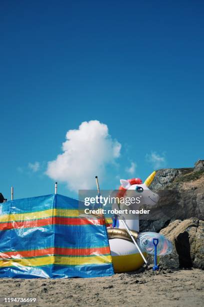 inflatable unicorn - beach shelter stockfoto's en -beelden