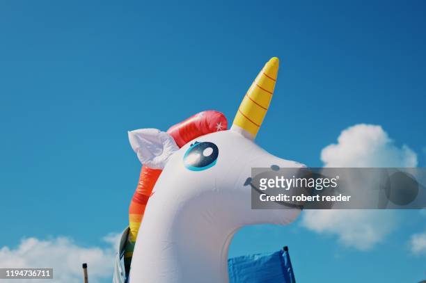 inflatable unicorn - unicorn stock pictures, royalty-free photos & images