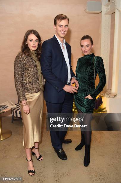 Lady Violet Manners, Oliver Renwick and Lady Eliza Manners attend The Gentleman's Journal Christmas Drinks at Wild by Tart on December 18, 2019 in...