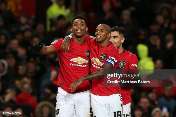 Anthony Martial of Manchester United celebrates scoring the third goal with Ashley Young during the Carabao Cup Quarter Final match between...