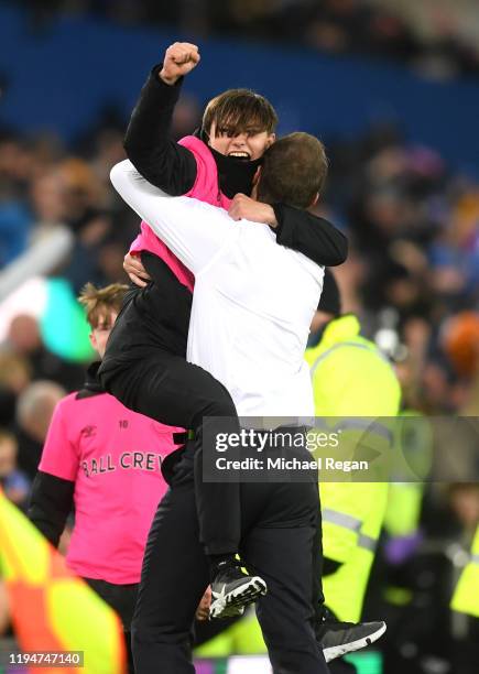 Interim Everton Manager, Duncan Ferguson celebrates with a ball boy after his sides second goal during the Carabao Cup Quarter Final match between...