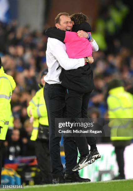 Interim Everton Manager, Duncan Ferguson celebrates with a ball boy after his sides second goal during the Carabao Cup Quarter Final match between...