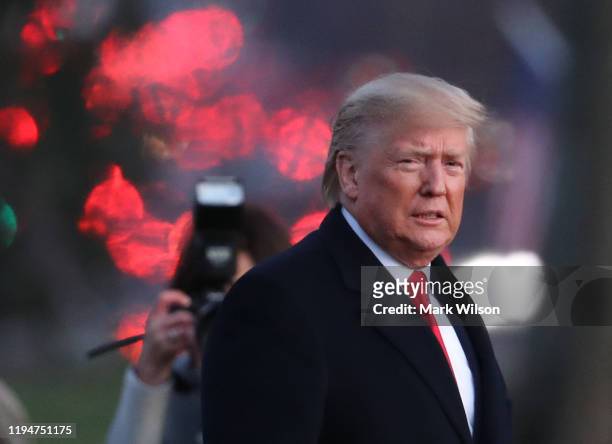 President Donald Trump walks toward Marine One prior to his departure for a campaign event in Battle Creek, Michigan, December 18, 2019 at the White...