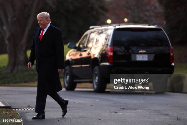 President Donald Trump walks towards Marine One on the South Lawn of the White House while departing for a “Merry Christmas” campaign rally in Battle...