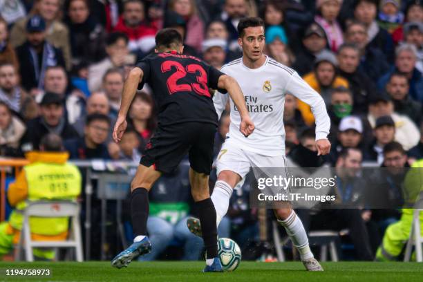 Sergio Reguilon of FC Sevilla and Lucas Vazquez of Real Madrid battle for the ball during the Liga match between Real Madrid CF and Sevilla FC at...