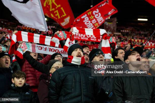 Liverpool fans sing before the Premier League match between Liverpool FC and Manchester United at Anfield on January 19, 2020 in Liverpool, United...
