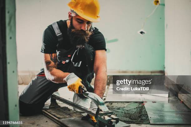 professional installer at work - dirty construction worker stock pictures, royalty-free photos & images