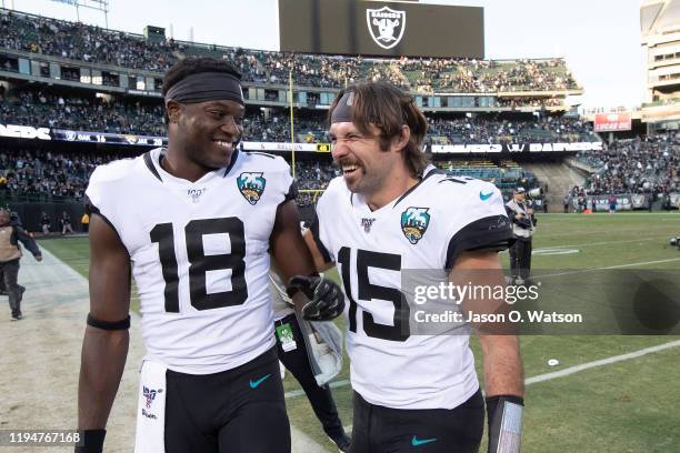 Quarterback Gardner Minshew II of the Jacksonville Jaguars celebrates with wide receiver Chris Conley after the game against the Oakland Raiders at...