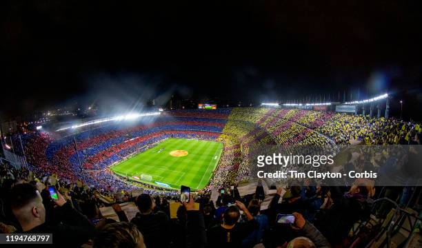 December 18: A spectacular panoramic view of Nou Camp Stadium as fans hold coloured placards before the start of the Barcelona V Real Madrid, La Liga...