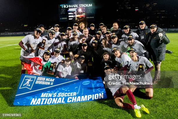 Charleston celebrates with the national championship trophy after winning the Division II Men's Soccer Championship held at Highmark Stadium on...