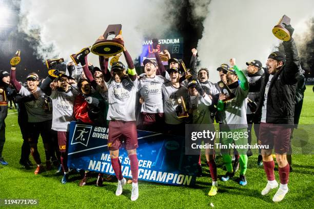 Charleston celebrates with the national championship trophy after winning the Division II Men's Soccer Championship held at Highmark Stadium on...