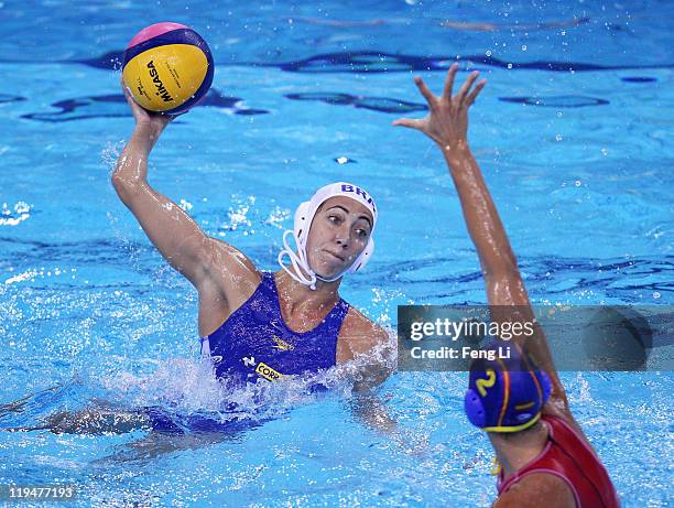 Cecilia Canetti of Brazil shoots past Blanca Gil Sorli of Spain in the Women's Water Polo first preliminary round match between Brazil and Spain...